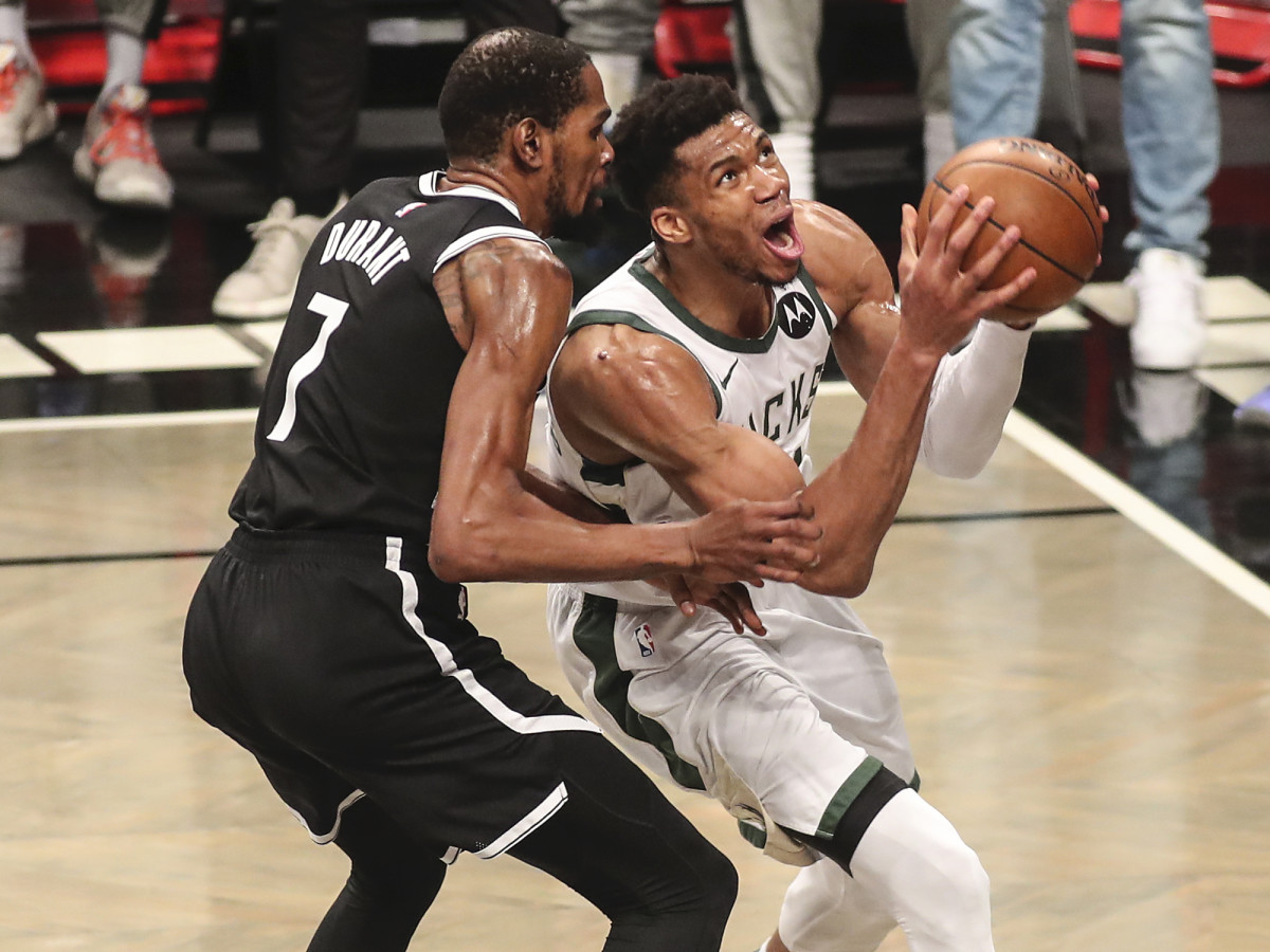 Milwaukee Bucks forward Giannis Antetokounmpo (34) drives past Brooklyn Nets forward Kevin Durant (7) in the third quarter during game seven in the second round of the 2021 NBA Playoffs